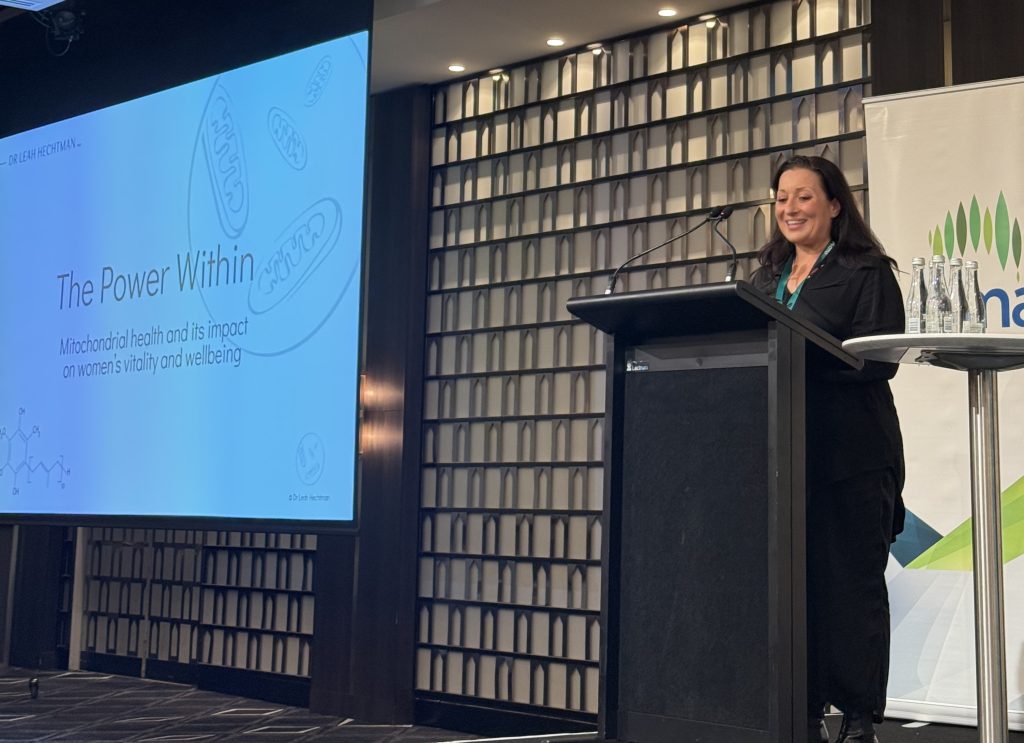 Dr Leah Hechtman standing at podium during CMA Innovation Day